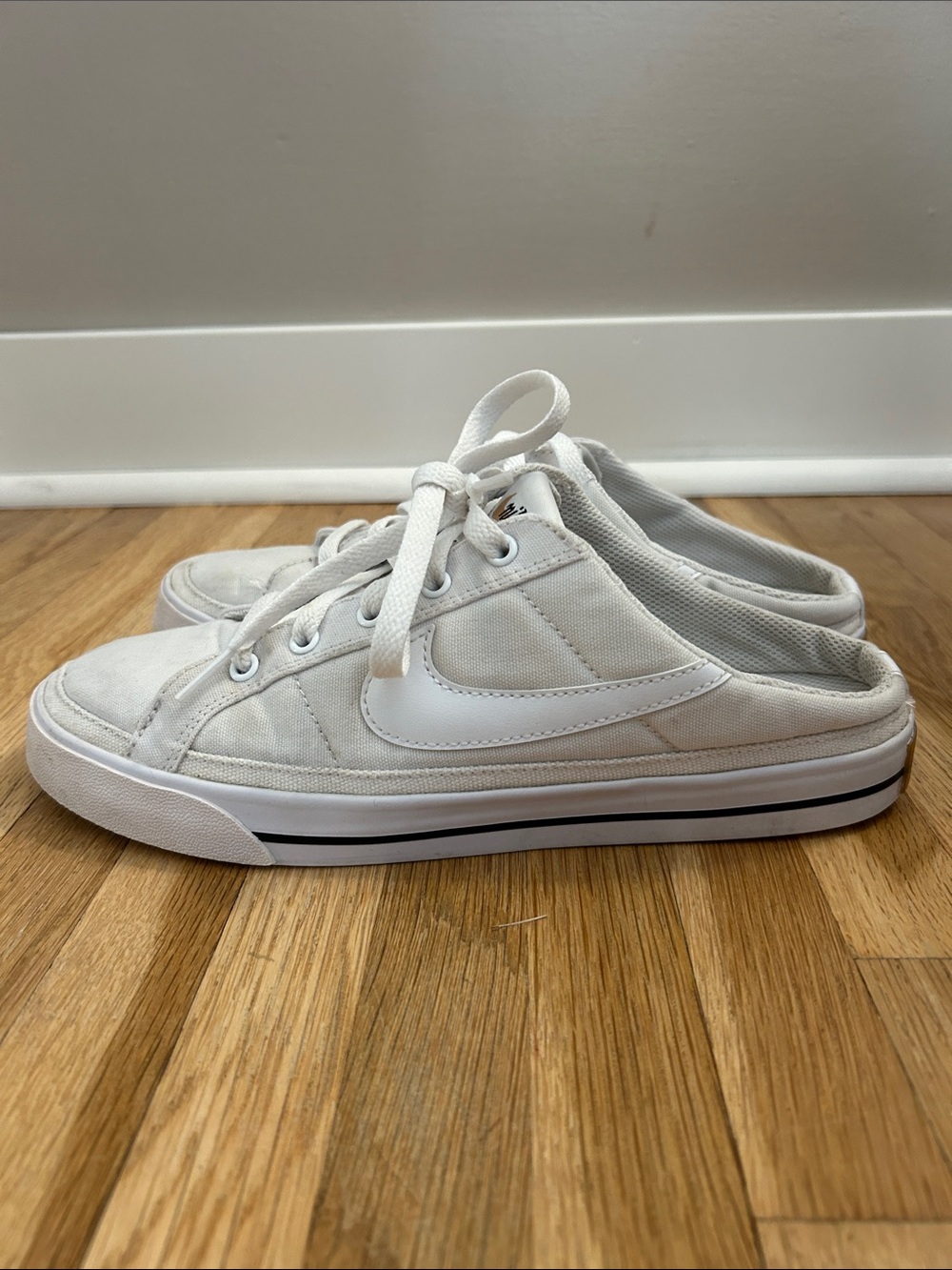 Nike. Women’s White Canvas Slip-On Sneakers. Size 9